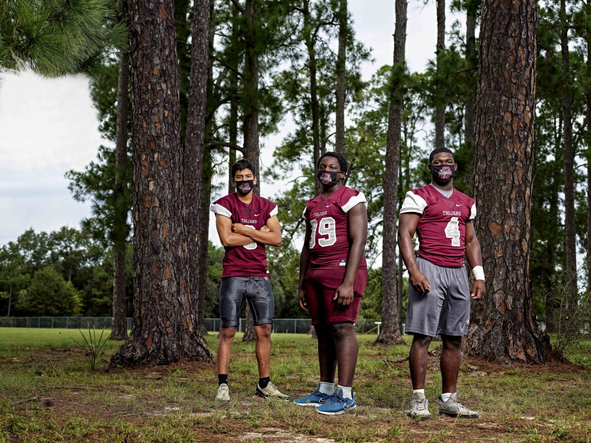 The Trojans have each been touched by COVID-19 in one way or another: Miguel (from left) had it; Ju-Marcus and Kameron watched it run through their families.